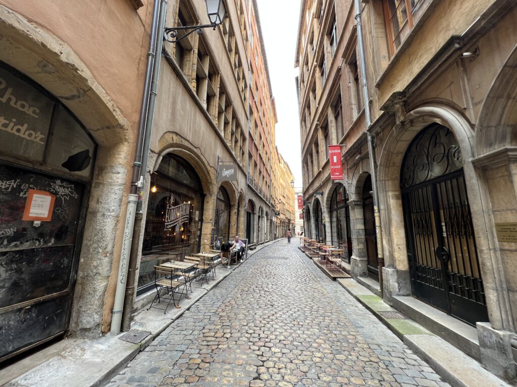 The old cobbled streets and Rennaissance architecture of Rue des Trois-Maries, Vieux Lyon.