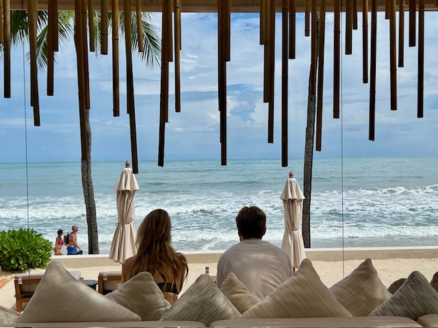 A couple enjoying the Chaweng Beach views at Salt Society Centara Reserve Samui